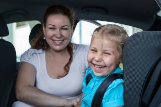 mum with child in car seat restraint